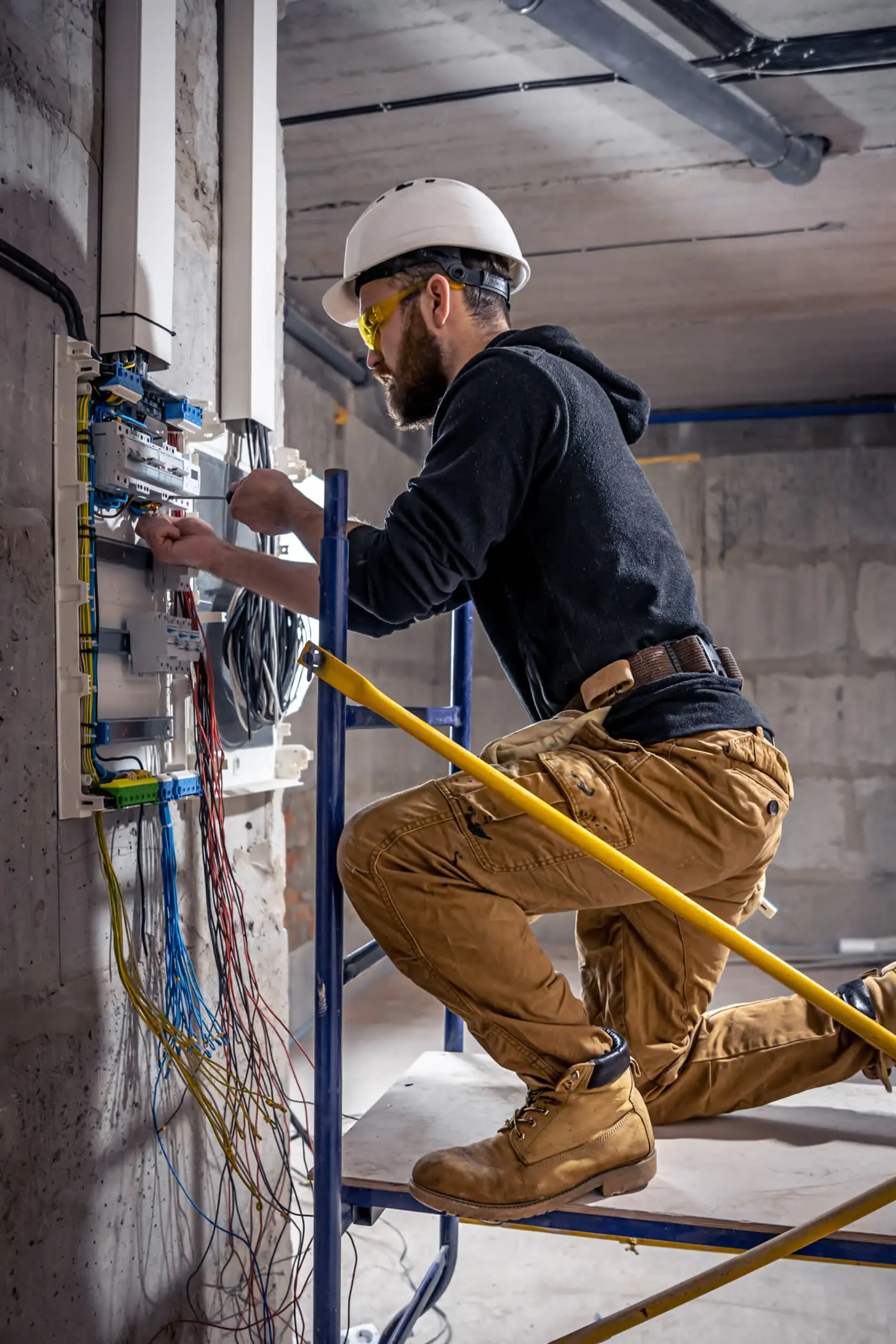 Electrician working at a switchboard